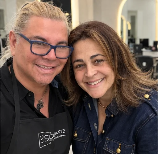 George with a happy client in the salon
