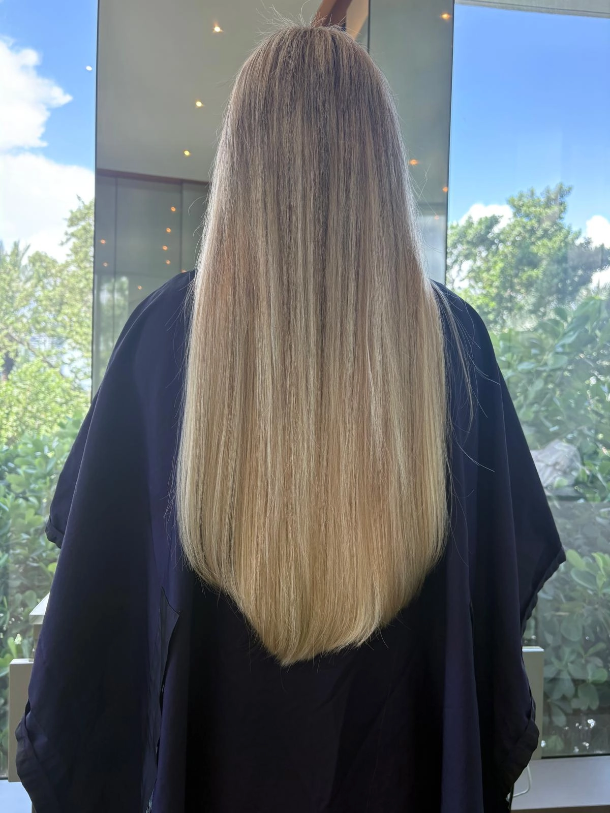 Long blonde highlights seen from behind
